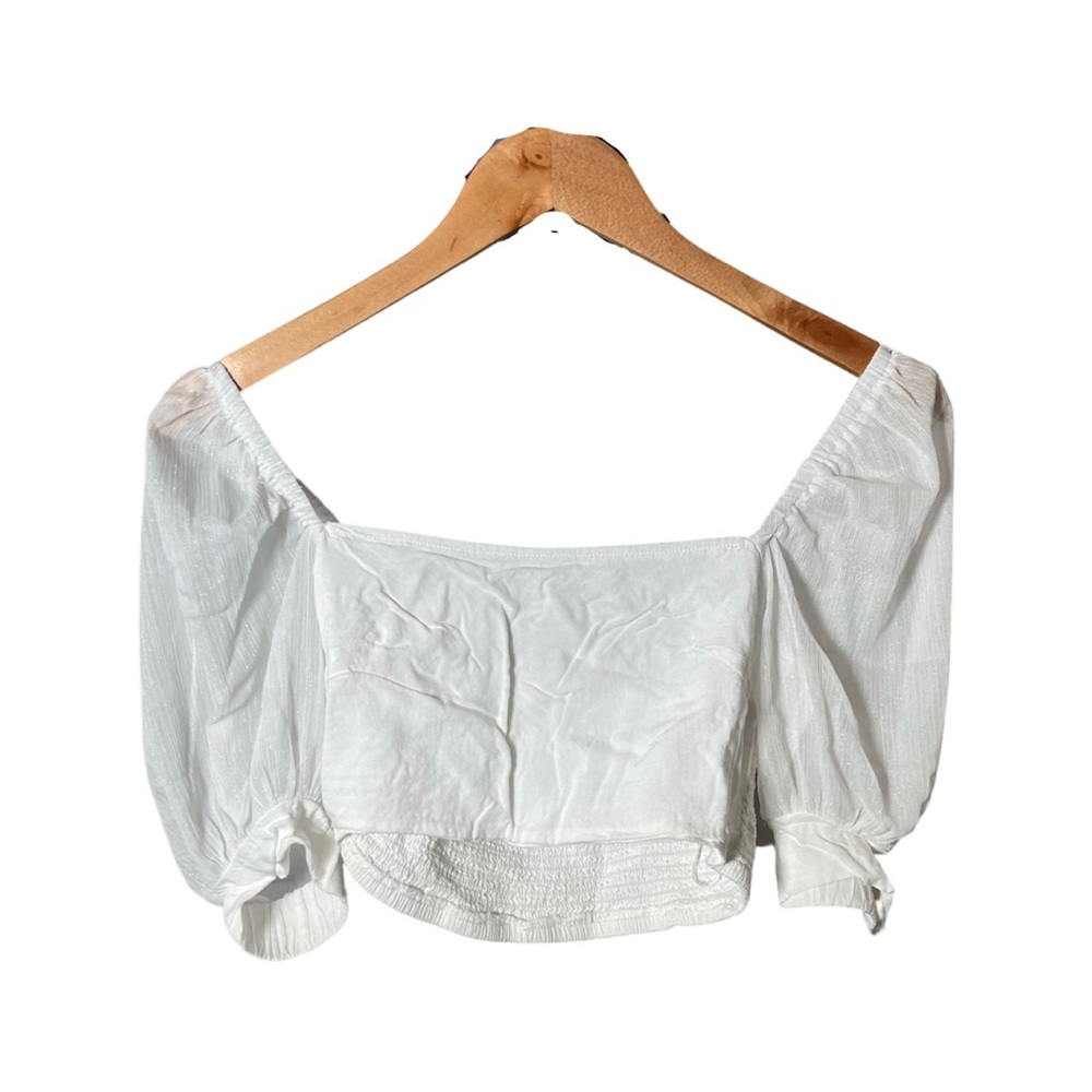 Sleeves go under the shoulder